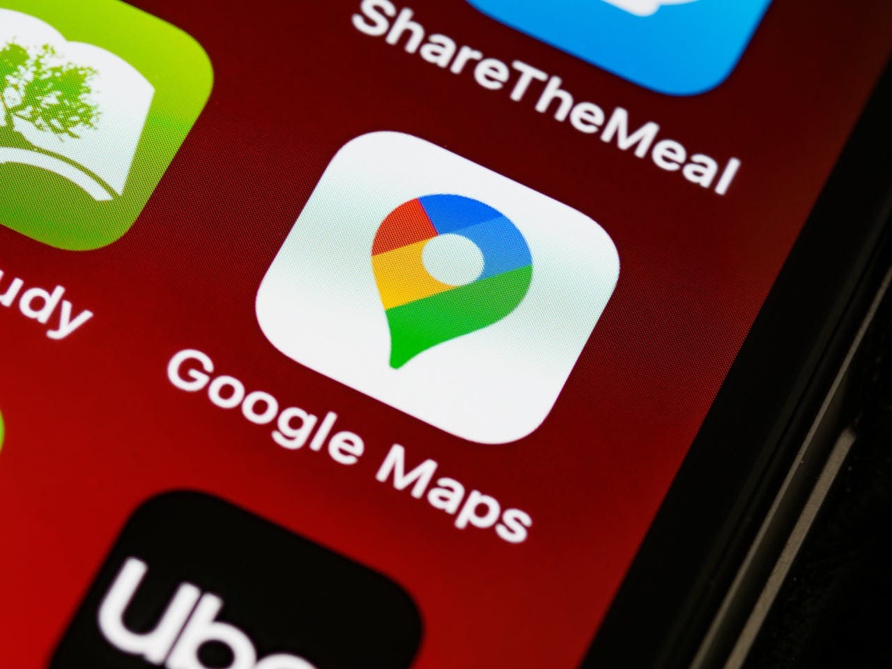 services-04 Detailed view of Google Maps app icon on a smartphone screen, showcasing digital navigation technology.